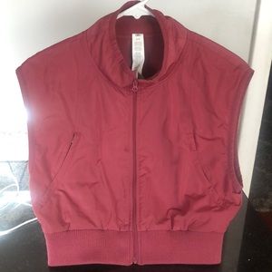 Alo fleece lined vest worn twice. Small stain by zipper but barely noticeable